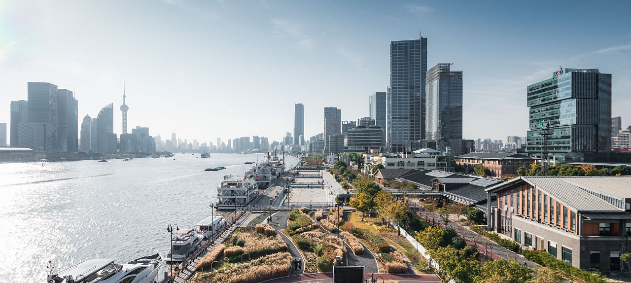 Photo of the Pudong riverside with the Twin Hills and the Lujiazui skyline beyond