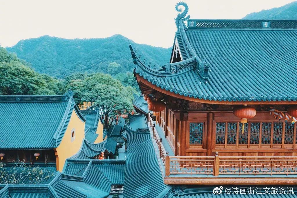 Faxi Temple's iconic round-door courtyard with yellow walls and black-tile roof