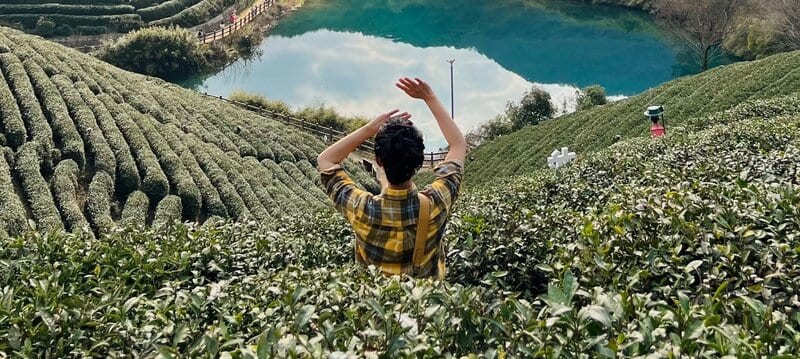 Guangming Temple Reservoir with tea terraces surrounding the water