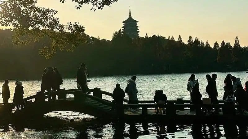 Panoramic view of Wushan cityscape and West Lake hills from the Jianghuihuiguan Pavilion viewing platform